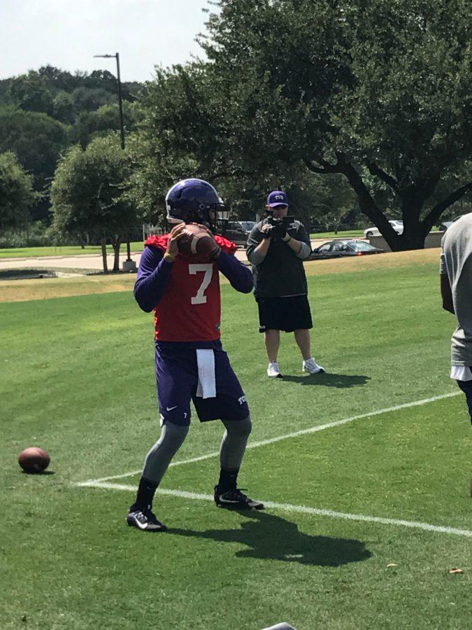 Kenny Hill readies to throw during a drill at the team's first practice. Photo by Jonathan Pickell. 