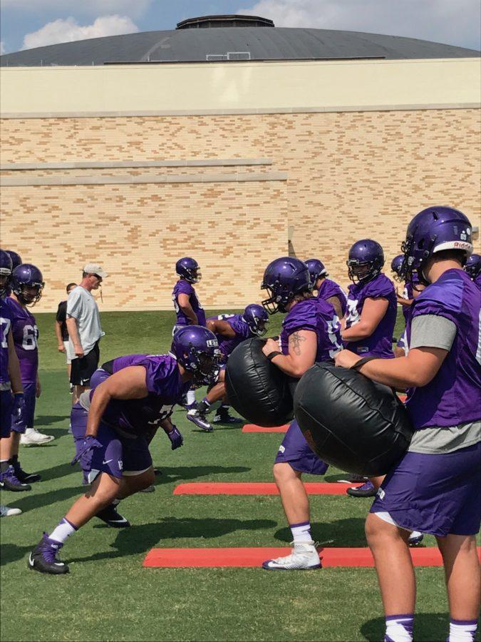 The TCU line goes through drill work at preseason practice. (Photo by Jonathan Pickell)