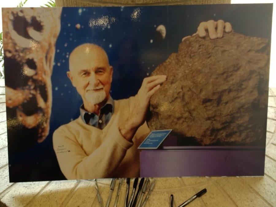 Dr. Arthur Ehlmann holds a meteorite from the Oscar E. Monnig Meteorite Collection he curated. (Photo by Kayley Ryan) 