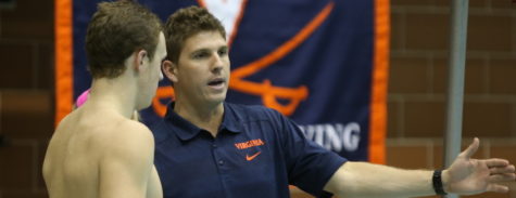 Sam Busch coaches up one of his swimmers at Virginia. (Photo courtesy of GoFrogs.com)