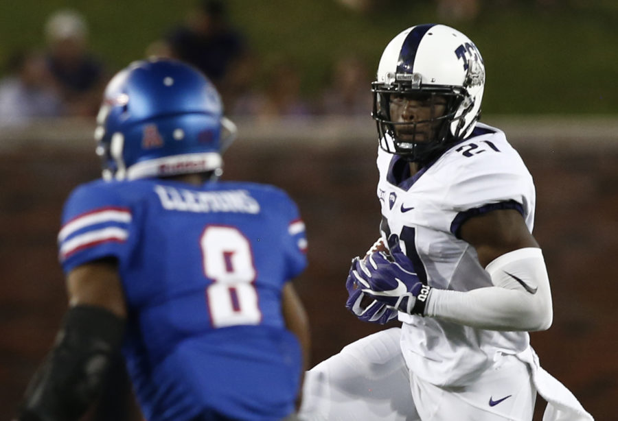 TCU+running+back+Kyle+Hicks+%2821%29+carries+the+ball+as+SMU+defensive+back+Rodney+Clemons+%288%29+comes+up+for+the+tackle+in+the+first+half+of+an+NCAA+college+football+game%2C+Saturday%2C+Sept.+23%2C+2016%2C+in+Dallas%2C+Texas.+%28AP+Photo%2FMike+Stone%29