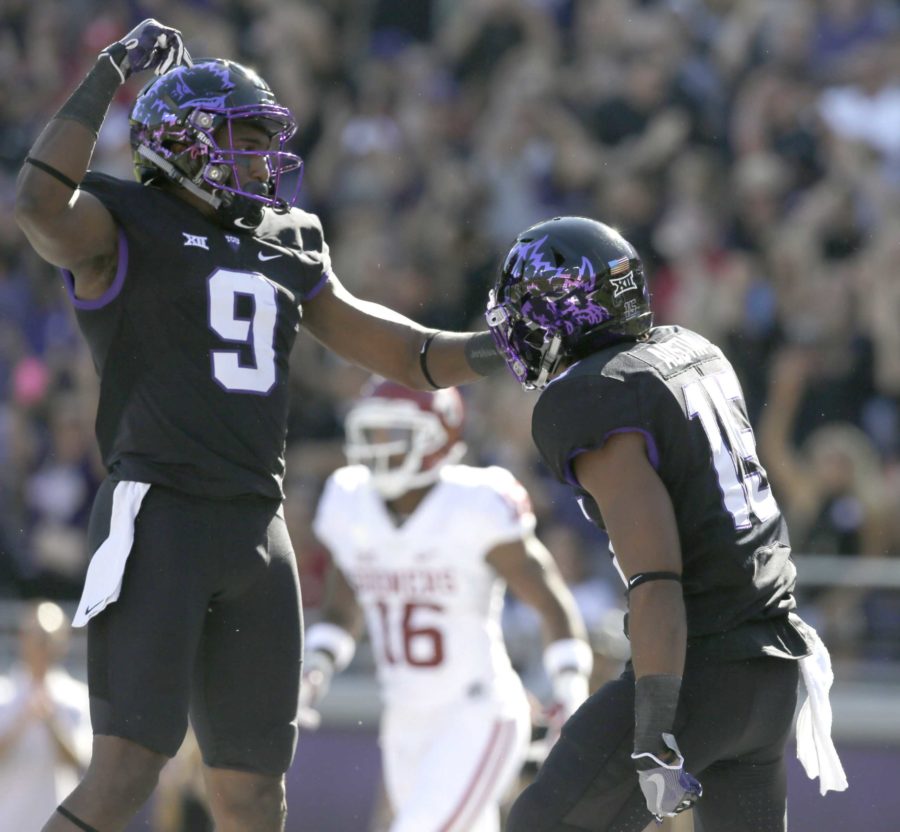 TCU wide receiver Jaelan Austin (15) celebrates his touchdown with teammate John Diarse (9) during the first quarter of an NCAA college football game against the Oklahoma, Saturday, Oct. 1, 2016, in Fort Worth, Texas. (AP Photo/LM Otero)