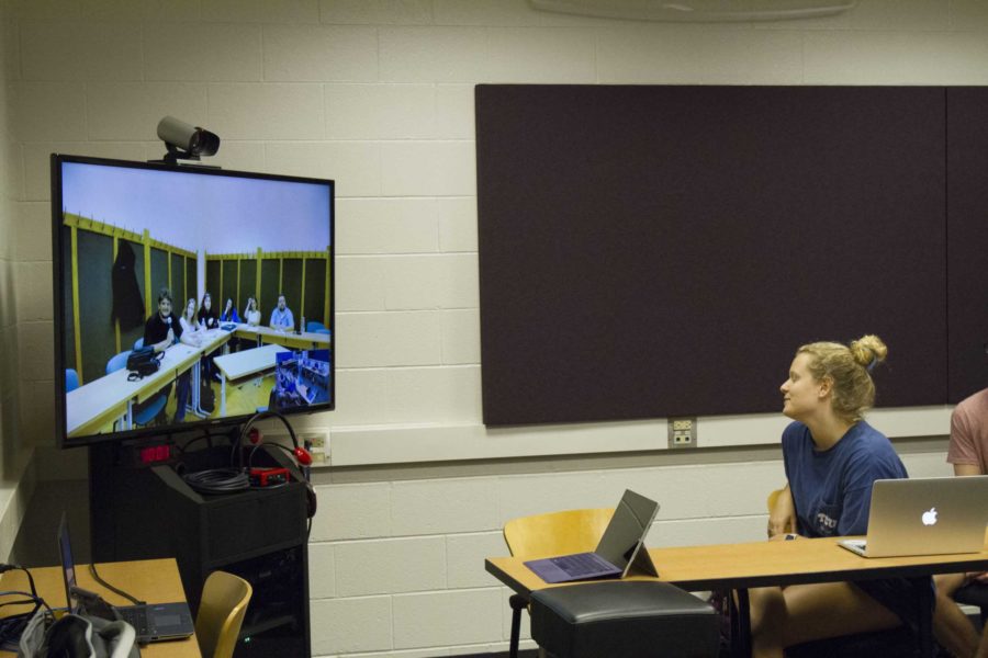 TCU students interact over a video conference feed with the students at the University of Debrecen. 