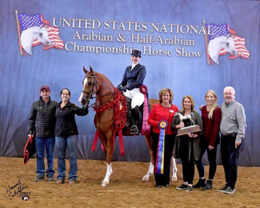 Sophomore+Sarah+Ellis+poses+with+her+horse%2C+Megatropolis%2C+trainers%2C+family+and+friends+after+winning+at+the+U.S.+Nationals.%0A%28Photo+courtesy+of+Sarah+Ellis%29