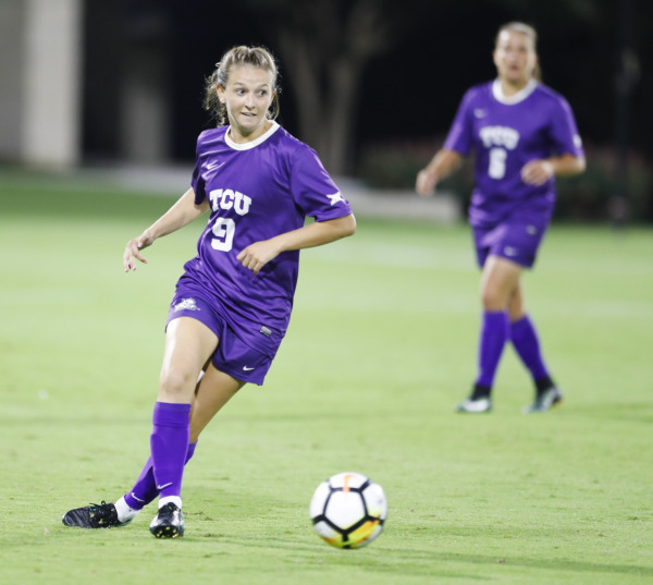 Kayla Hill looks for options to pass to Friday night against Oklahoma State. The Frogs dropped the match 2-0. 