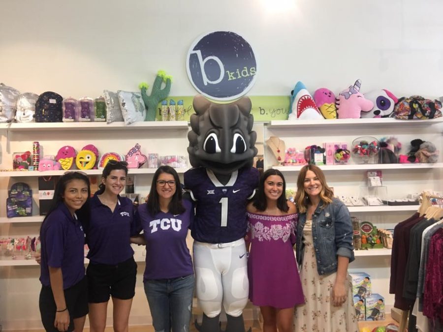 TCU+fans+interact+with+SuperFrog+on+September+20+during+Go+Purple+Friday.%0A%0APhoto+Courtesy+of+TCU+Athletics+