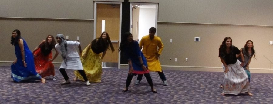 Members of the students for Asian Indian cultural awareness organization dance to lively Bollywood music 