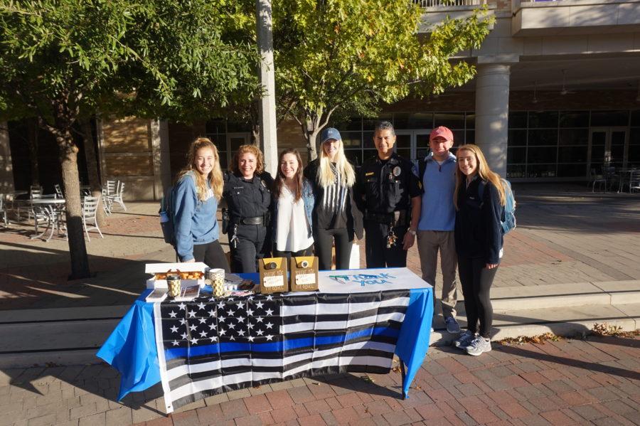 Junior sociology major Jackie Williams, Officer Pam Christian, first-year pre-business major and College Republicans member Katy Callewart, senior economics major and Back the Blue chair Hannah Saffle, Officer Eric Abilez, first-year pre-business major and College Republicans member Brayden Lambrecht, and first-year pre-major Janie Kimball at the Coffee with Cops event outside on Wednesday, October 25. (Photo courtesy of Lana Wynn.) 