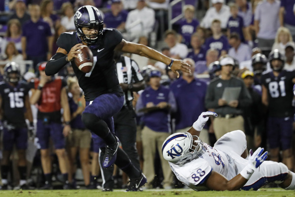 TCU quarterback Kenny Hill breaks away from the Kansas defense in the Horned Frogs 43-0 victory Saturday night. Photo courtesy of GoFrogs.com