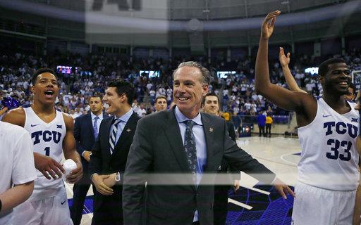 TCU head coach Jamie Dixon celebrates with his team after the TCU Horned Frogs beat the Richmond Spiders 86-68 in their NIT round three game in Fort Worth, Tuesday, March 21, 2017.