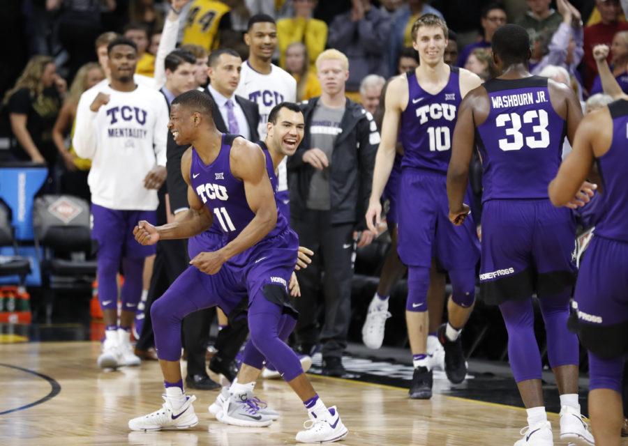 TCU guard Brandon Parrish (11) celebrates with teammate Michael Williams at the end of a second-round game against Iowa in the NIT college basketball tournament, Sunday, March 19, 2017, in Iowa City, Iowa. TCU won 94-92. (AP Photo/Charlie Neibergall)