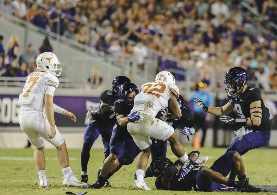 Niko Small tackles Texas running back Daniel Young en route to a 24-7 victory over the Longhorns. Photo courtesy of Christian Argueta Soto. 