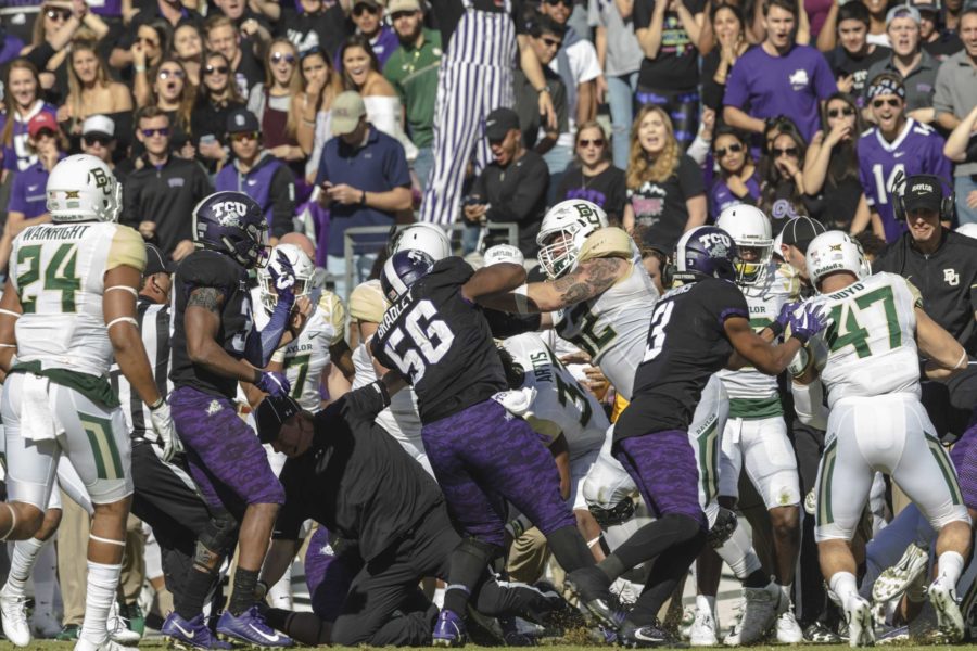 Chris Bradley (56) and the Horned Frog defense clashes with the Baylor sideline. Photo by Cristian ArguetaSoto