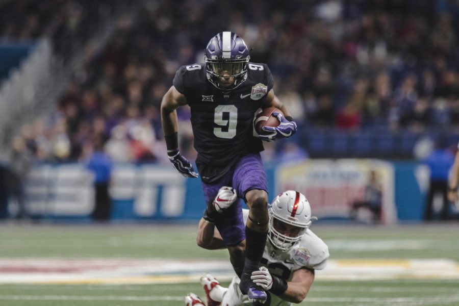 TCU wide receiver John Diarse breaks a tackle in the Horned Frogs 39-37 victory over Stanford in the 2017 Alamo Bowl. Photo by Cristian ArguetaSoto.