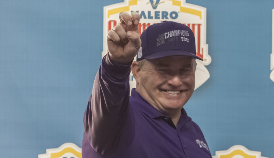 Gary Patterson throws up the Go Frogs as he poses on stage following the Alamo Bowl. Photo by Cristian ArguetaSoto