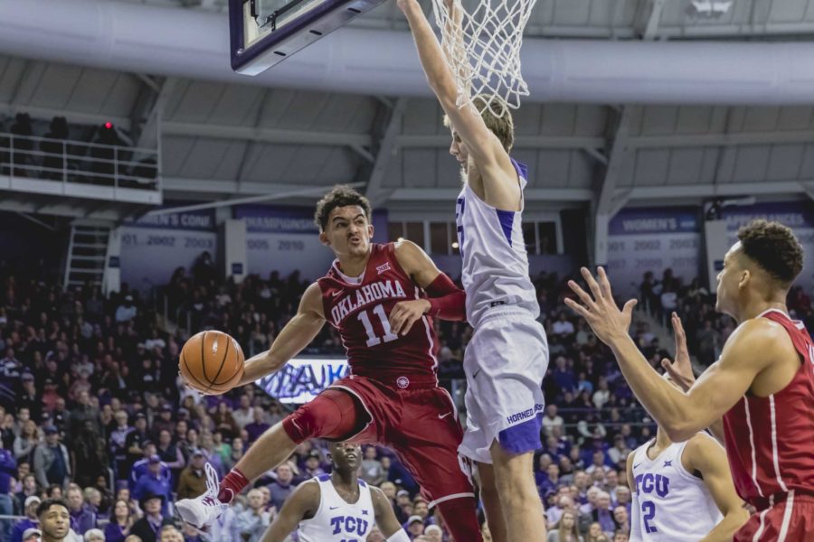 TCU forward Vladimir Brodziansky tries to cut off Oklahoma point guard Trae Young from driving down the baseline. Photo by Cristian ArguetaSoto