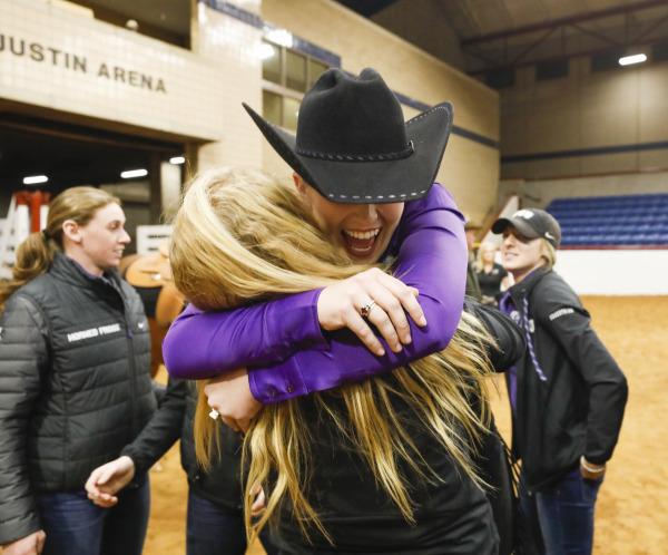 Sophomores Laska Anderson and Courtney May embrace each other following a stunning victory over Texas A&M. Image courtesy of gofrogs.com