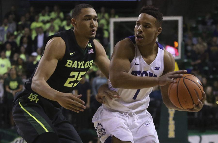 TCU guard Desmond Bane (1) works against Baylor forward Tristan Clark (25) during the first half of an NCAA college basketball game Tuesday, Jan. 2, 2018, in Waco, Texas. (AP Photo/Jerry Larson)