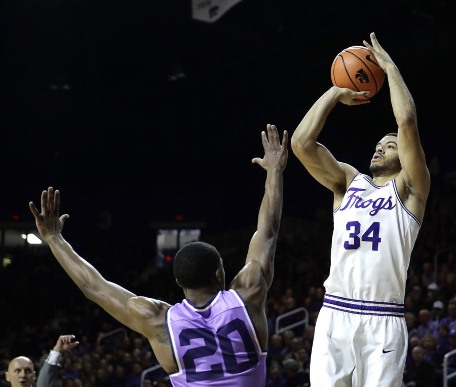 TCUs Kenrich Williams (34) shoots over Kansas States Xavier Sneed (20) during the first half of an NCAA college basketball game Saturday, Jan. 20, 2018, in Manhattan, Kan. (AP Photo/Charlie Riedel)