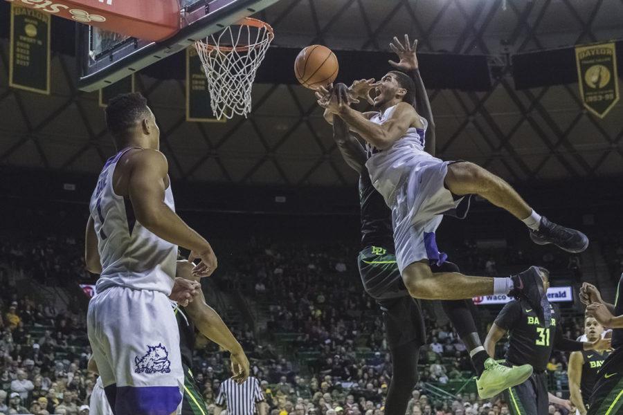 TCU+guard+Kenrich+Williams+is+fouled+driving+to+the+rim+against+Baylor.+Photo+by+Cristian+ArguetaSoto