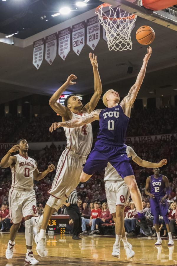 TCU guard Jaylen Fisher drives to the hoop against Oklahomas Trae Young. Photo by Cristian ArguetaSoto
