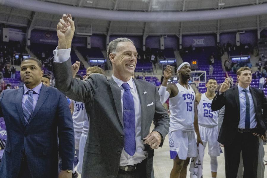 TCU head coach Jamie Dixon celebrate the Horned Frog victory during the signing of the alma mater. Photo by Cristian ArguetaSoto