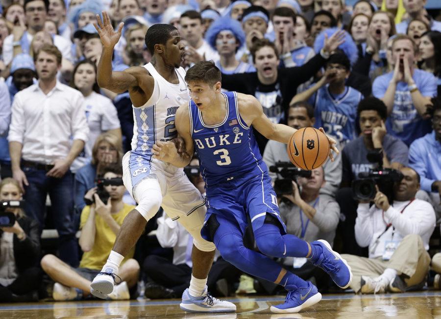 North Carolinas Kenny Williams (24) guards Dukes Grayson Allen (3) during the first half of an NCAA college basketball game in Chapel Hill, N.C., Thursday, Feb. 8, 2018. (AP Photo/Gerry Broome)
