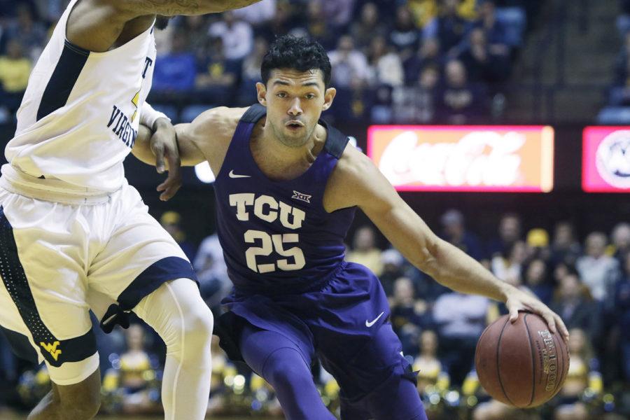 TCU+guard+Alex+Robinson+%2825%29+drives+while+being+defended+by+West+Virginia+guard+Daxter+Miles+Jr.+%284%29+during+the+first+half+of+an+NCAA+college+basketball+game+Monday%2C+Feb.+12%2C+2018%2C+in+Morgantown%2C+W.Va.+%28AP+Photo%2FRaymond+Thompson%29