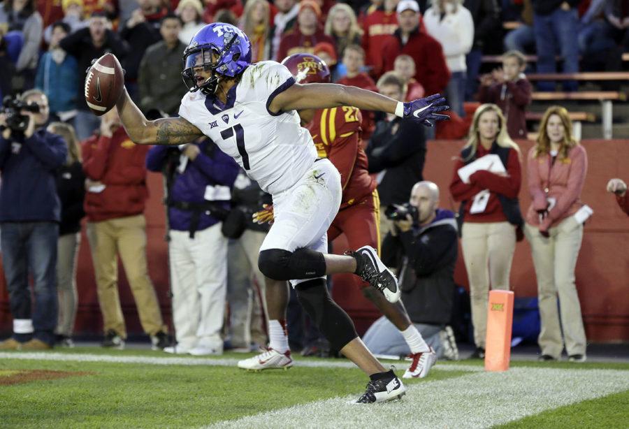 TCU wide receiver Kolby Listenbee celebrates after catching a touchdown pass during the first half of an NCAA college football game against Iowa State, Saturday, Oct. 17, 2015, in Ames, Iowa. (AP Photo/Charlie Neibergall)