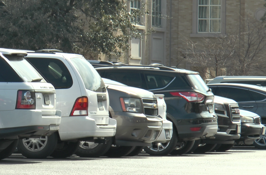A row of cars parked in the Harrison lot behind the Brite Divinity Building, Friday, February 9, 2018 in Fort Worth, Texas. (Photo by Hunter Smith)