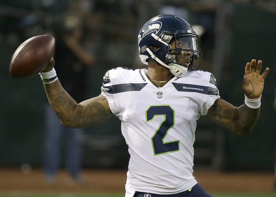 FILE - In this Aug. 31, 2017, file photo, Seattle Seahawks quarterback Trevone Boykin (2) passes against the Oakland Raiders during the first half of an NFL preseason football game in Oakland, Calif. The Seattle Seahawks released quarterback Trevone Boykin shortly after his girlfriend alleged in a television interview that he physically assaulted her in Texas. The practice squad player was released from the team Tuesday, March 27, 2018, after WFAA-TV in Dallas posted an interview with Boykins girlfriend. She alleges he broke her jaw during an altercation last week in Mansfield, southwest of Dallas. Boykins agent, Drew Pittman, told the station the allegations are false. Mansfield police told WFAA that Boykin is under investigation. (AP Photo/Eric Risberg, File)