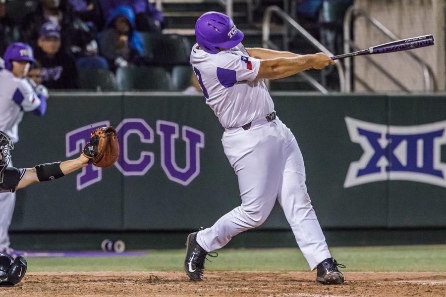 Luken Baker launches a ball past the left field wall to give the Horned Frogs a 3-2 lead. Photo by Cristian Argueta Soto. 