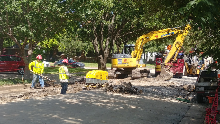 Construction crews install new waterline on W. Cantey Street for the fashion merchandising building.