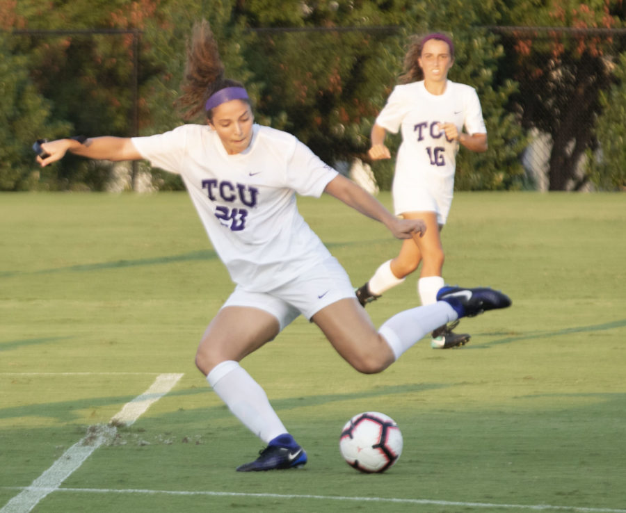 Tara Smith (16) looks on as Maddy Warren (20) fires a shot at goal against SMU on August 26, 2018. Photo by Jack Wallace.