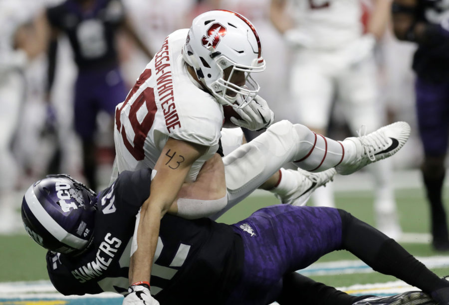 Stanford wide receiver J.J. Arcega-Whiteside (19) is dropped by TCU linebacker Ty Summers (42) during the first half of the Alamo Bowl NCAA college football game, Thursday, Dec. 28, 2017, in San Antonio. (AP Photo/Eric Gay)