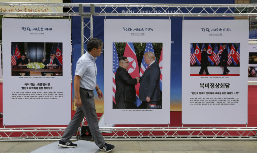 Photos of the summit between U.S. President Donald Trump and North Korean leader Kim Jong Un are displayed during a photo exhibition to wish for peace on the Korean Peninsula in Seoul, South Korea, Wednesday, Sept. 19, 2018. This weeks inter-Korean summit talks ended with a set of sweeping agreements on denuclearization of the Korean Peninsula, reducing a military standoff and other reconciliation issues. The signs read:  The summit between the United States and North Korea.(AP Photo/Ahn Young-joon)