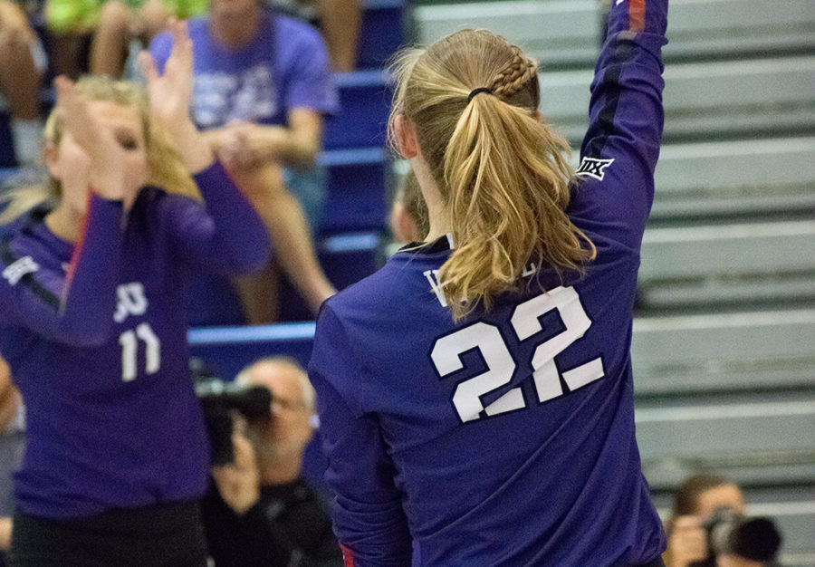 Ashley Waggle celebrates a point with her teammates. Photo by Eric Sasadeusz