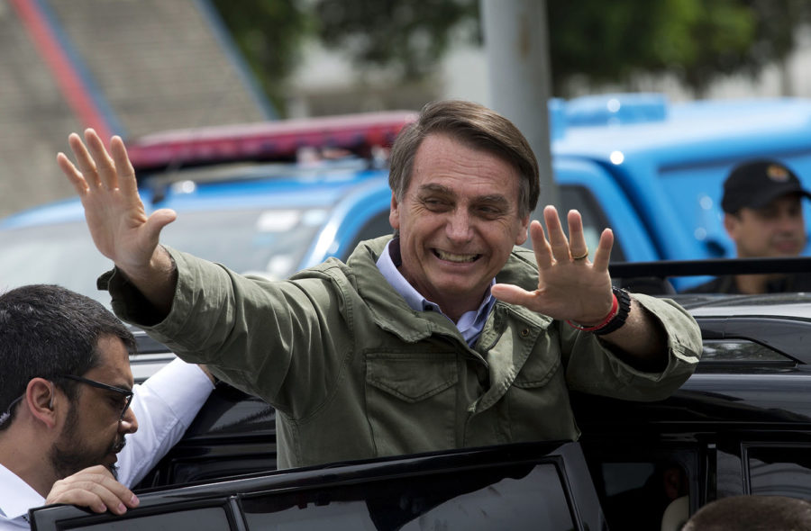 Jair+Bolsonaro%2C+presidential+candidate+with+the+Social+Liberal+Party%2C+waves+after+voting+in+the+presidential+runoff+election+in+Rio+de+Janeiro%2C+Brazil%2C+Sunday%2C+Oct.+28%2C+2018.+Bolsonaro+is+running+against+leftist+candidate+Fernando+Haddad+of+the+Workers%E2%80%99+Party.+%28AP+Photo%2FSilvia+izquierdo%29