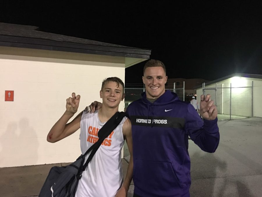 TCU+linebacker+Ty+Summers+congratulates+Luke+Anderson+after+Calvary+Christian+Academys+48-36+victory+over+Trinity+Christian+Academy.+Photo+courtesy+of+Tim+Anderson.