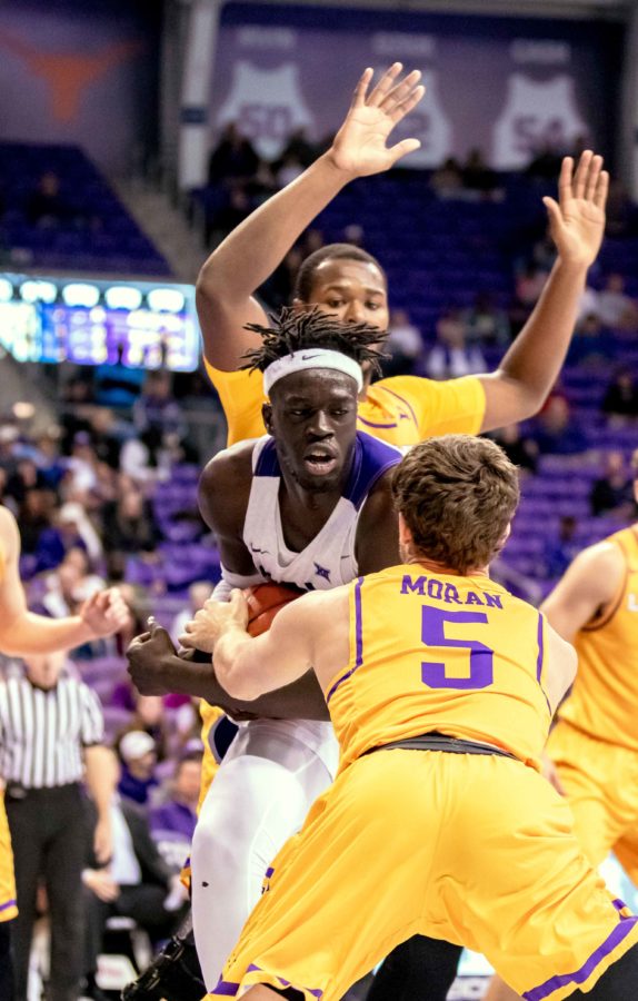 Lipscomb smothers TCU center Yuat Alok in the paint. Photo by Cristian ArguetaSoto. 