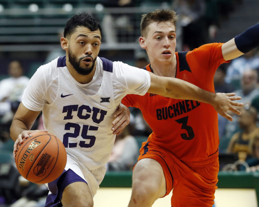 TCU guard Alex Robinson (25) gets past Bucknell guard Jimmy Sotos (3) during the second half of an NCAA college basketball game at the Diamond Head Classic, Sunday, Dec. 23, 2018, in Honolulu. (AP Photo/Marco Garcia)
