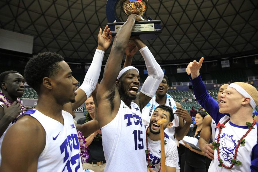 TCU forward JD Miller (15) holds the winning trophy after TCU defeated Indiana State 83-69 in an NCAA college basketball game to win the Diamond Head Classic, Tuesday, Dec. 25, 2018, in Honolulu. (AP Photo/Marco Garcia)