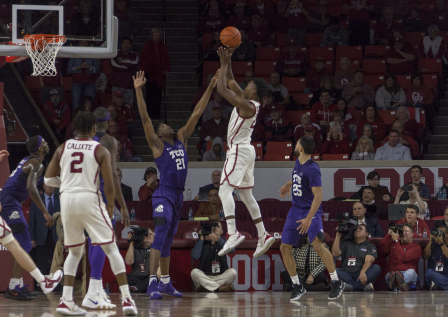 Oklahoma+forward+Kristian+Doolittle+banks+in+the+game-winning+shot+over+TCU+center+Kevin+Samuel+two+two+seconds+to+play+in+Norman.+Photo+by+Melissa+Triebwasser.