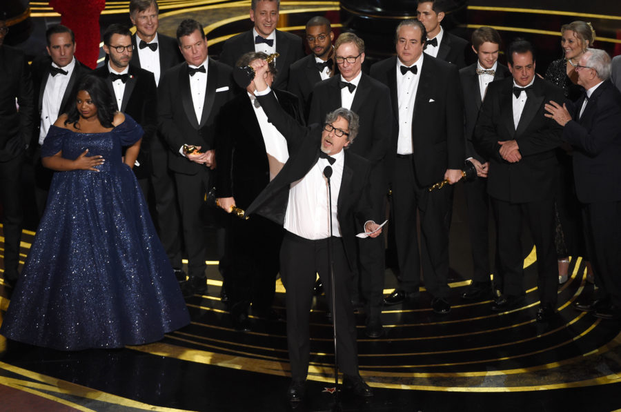 Peter Farrelly, center, and the cast and crew of Green Book accept the award for best picture at the Oscars on Sunday, Feb. 24, 2019, at the Dolby Theatre in Los Angeles. (Photo by Chris Pizzello/Invision/AP)