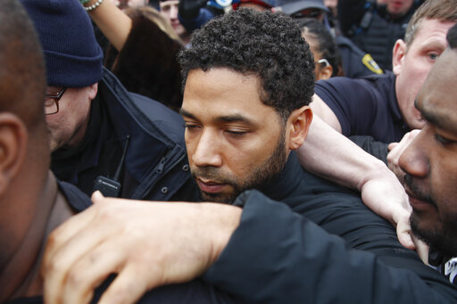 FILE - In this Feb. 21, 2019 file photo, Jussie Smollett leaves George N Leighton Criminal Courthouse in Chicago. A lawyer for Smollett is asking a judge to allow the Empire actor to travel while he is free on bond on charges he falsely reported being attacked by two masked men. (AP Photo/Kamil Krzaczynski, File)