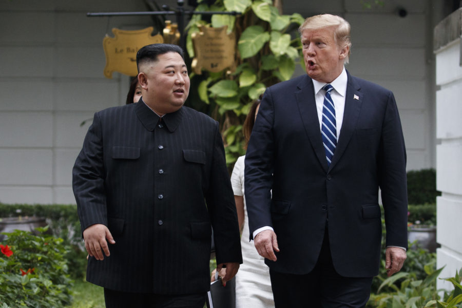 U.S. President Donald Trump and North Korean leader Kim Jong Un take a walk after their first meeting at the Sofitel Legend Metropole Hanoi hotel, Thursday, Feb. 28, 2019, in Hanoi. (AP Photo/Evan Vucci)