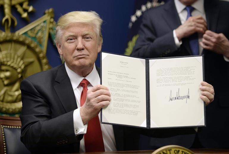 President Trump signs an executive order
(Photo by Olivier Douliery-Pool/Getty Images)