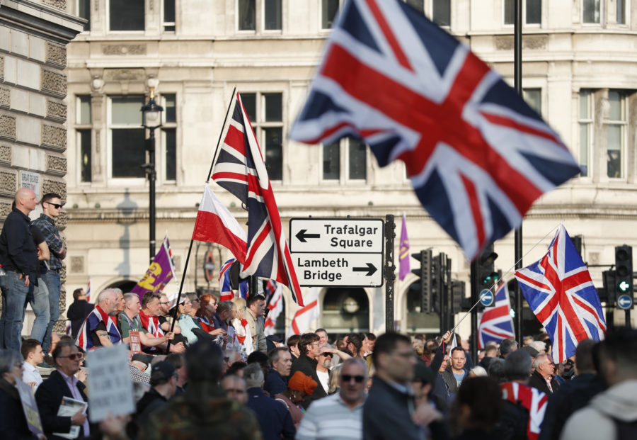 Protester wave British union flags as people gather near parliament during Brexit demonstrations in London, Friday March 29, 2019. Britains politicians voted Friday to reject Prime Minister Theresa Mays European Union Brexit divorce deal, amid continuing public opposition. (AP Photo/Alastair Grant)