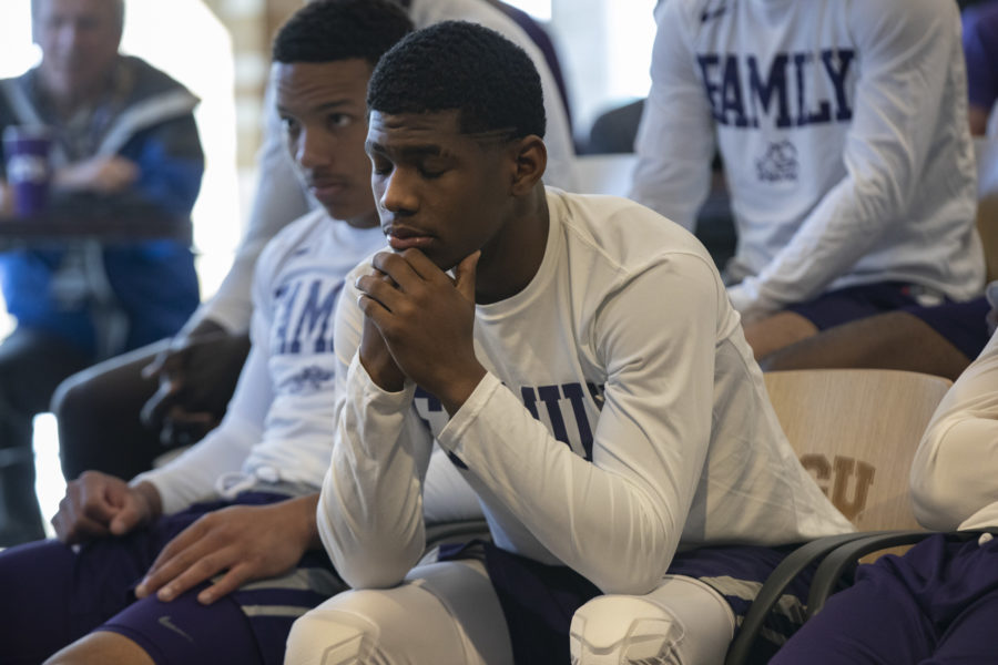 TCU guards Desmond Bane (left) and Kenric Davis (center) soak in the reality that the Horned Frogs arent going back to March Madness. Photo by Heesoo Yang. 