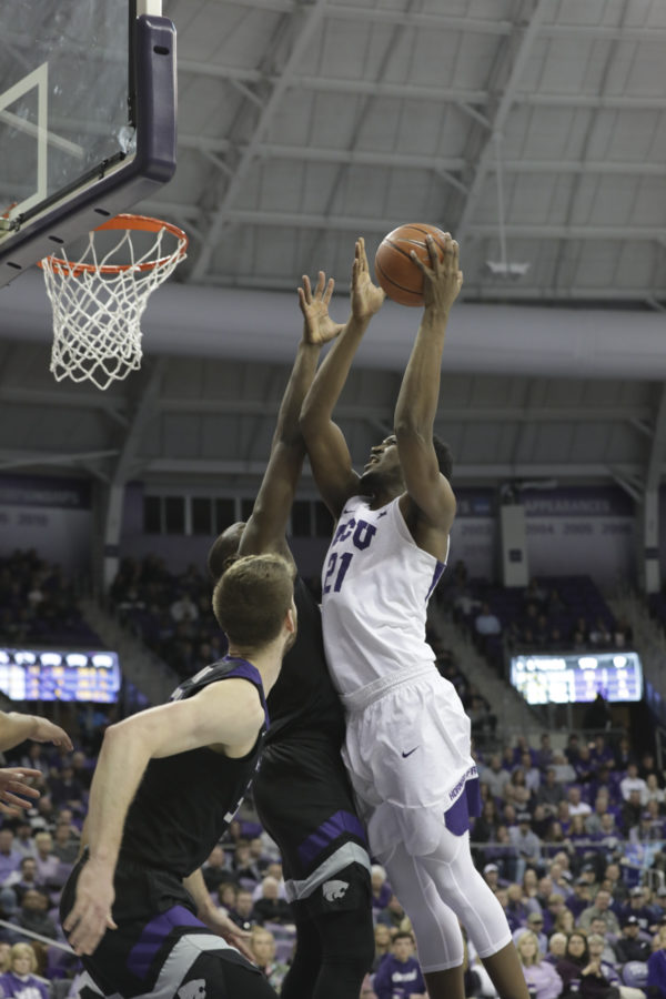 TCU center Kevin Samuel scores over the K-State defense. Photo by Heesoo Yang